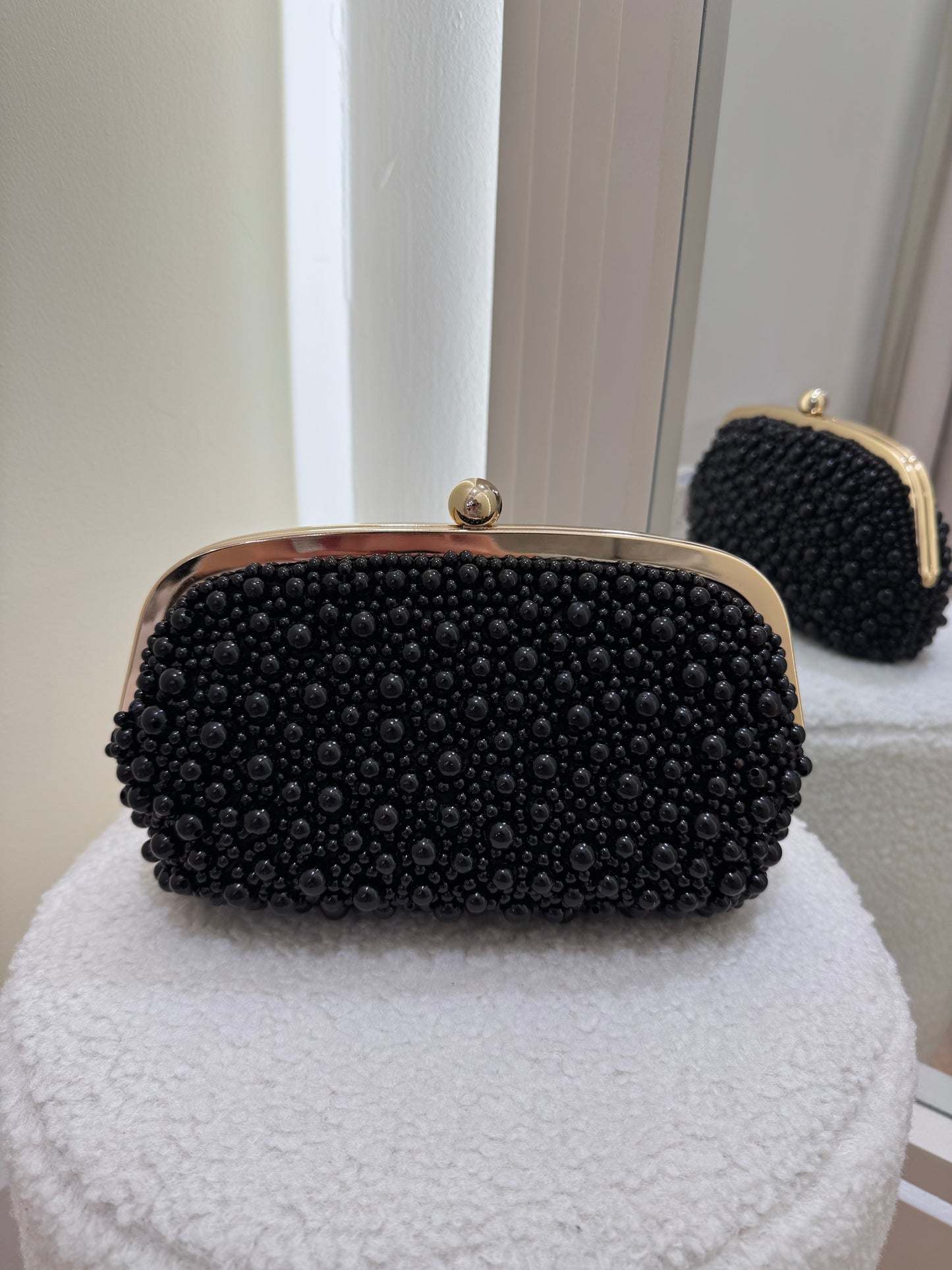 Black pearl clutch bag