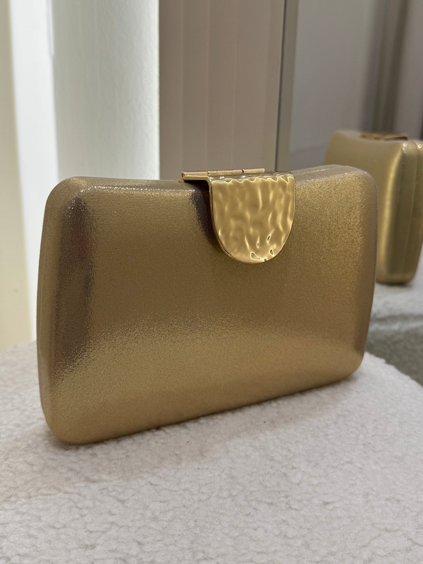 Gold clutch bag
