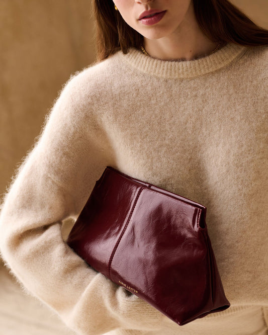 Laila Textured Patent Clutch bag in Cherry