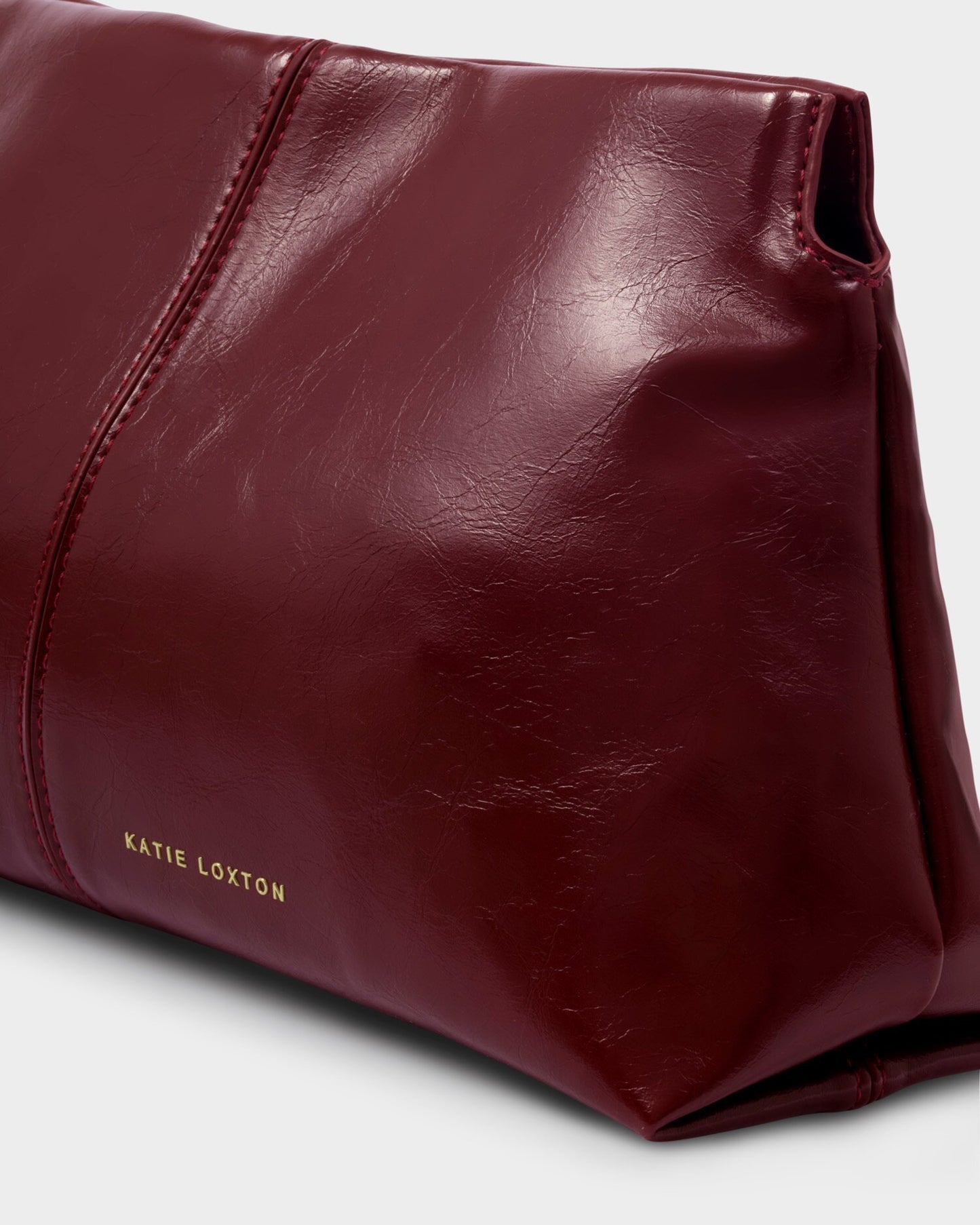 Laila Textured Patent Clutch bag in Cherry